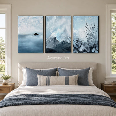 Deep Passage snow branch triptych with a black frame above a bed in a bedroom