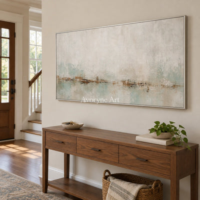 Woven Measure soft neutral abstract wall art with a silver frame in an entryway