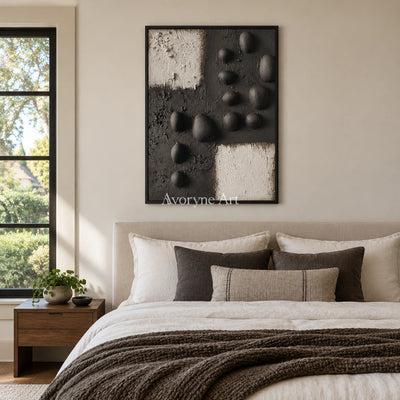 Lucent Sonata stone dot relief wall art with a black frame above a bed in a bedroom