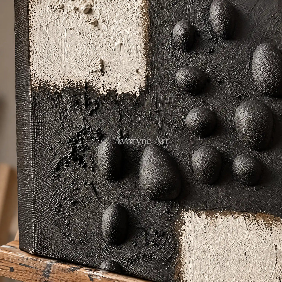 Close-up of the hand-painted texture of Lucent Sonata stone dot relief wall art on an easel