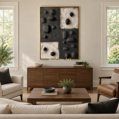 Muted Refrain stone dot relief wall art with a gold frame hanging in a living room