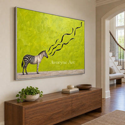 Tender Story surreal scene wall art with a silver frame in an entryway