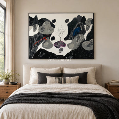 Misted Measure surreal stone landscape wall art with a black frame above a bed in a bedroom