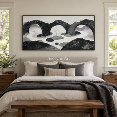 Misted Rhythm surreal stone landscape wall art with a black frame above a bed in a bedroom