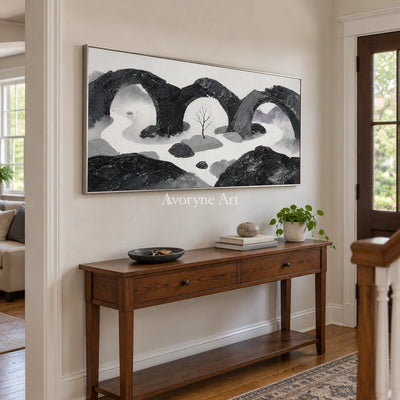Misted Rhythm surreal stone landscape wall art with a silver frame in an entryway