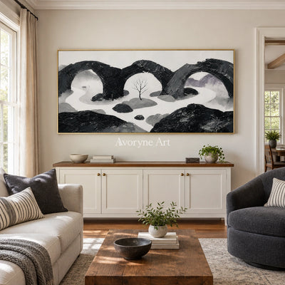 Misted Rhythm surreal stone landscape wall art with a gold frame hanging in a living room
