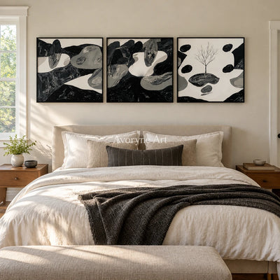 Misted Haven surreal stone landscape triptych with a black frame above a bed in a bedroom