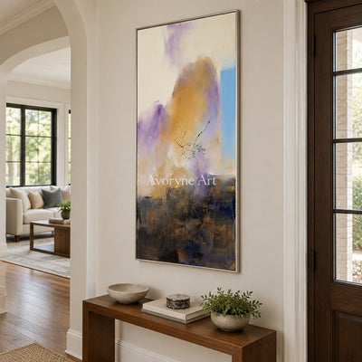 Pale Story textured landscape wall art with a silver frame in an entryway