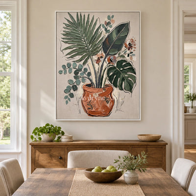 Silver Cadence vase and foliage wall art with a white frame in a dining room