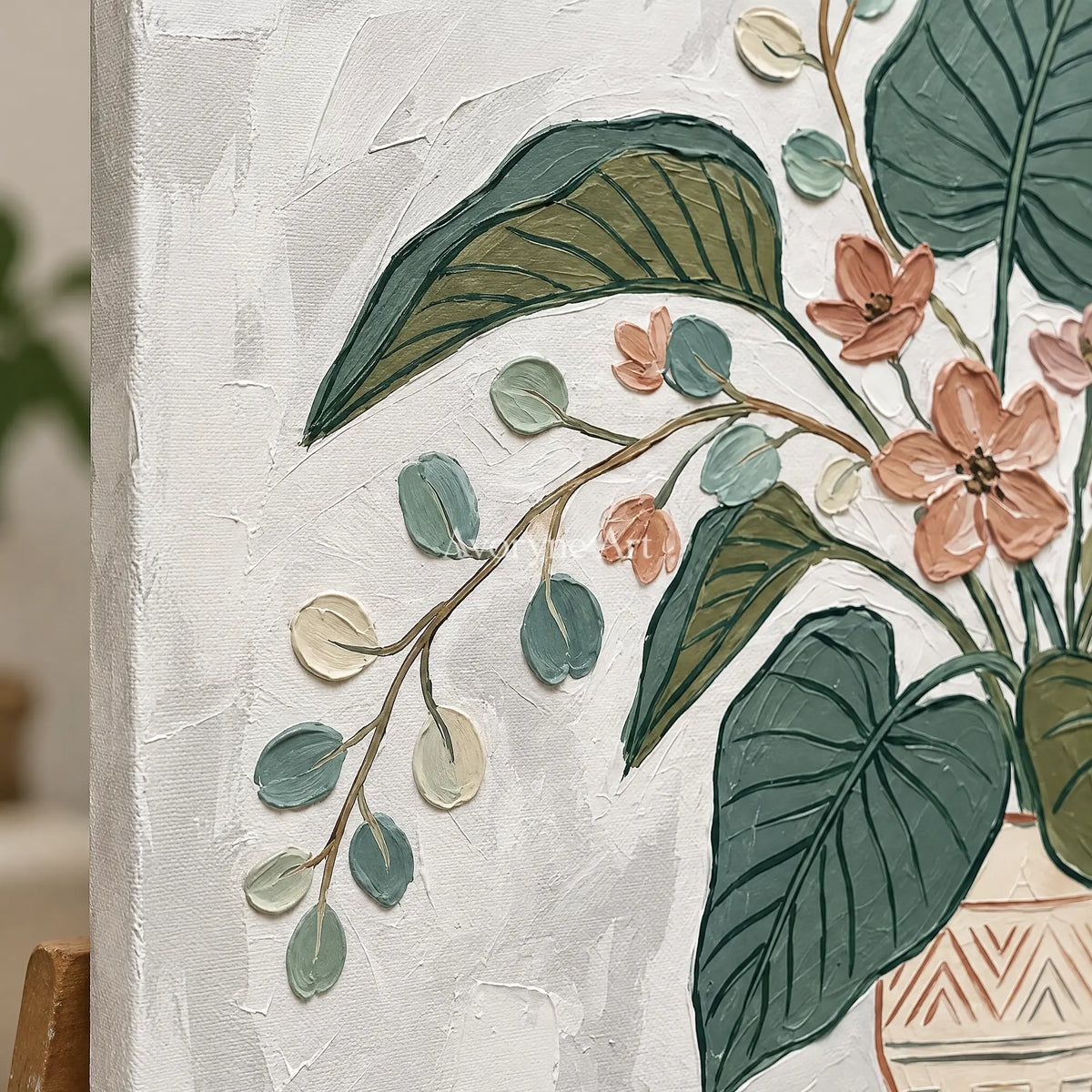 Close-up of the hand-painted texture of Silver Passage vase and foliage wall art on an easel