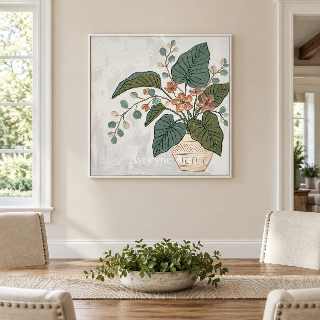 Silver Passage vase and foliage wall art with a white frame in a dining room
