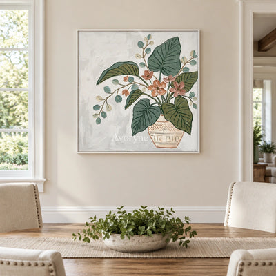 Silver Passage vase and foliage wall art with a white frame in a dining room