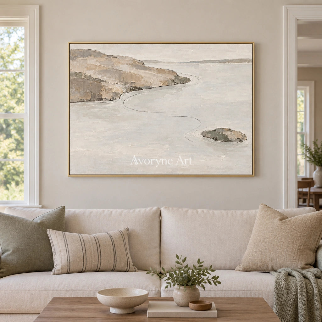 Still Solace waterside landscape wall art with a gold frame hanging in a living room
