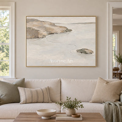 Still Solace waterside landscape wall art with a gold frame hanging in a living room
