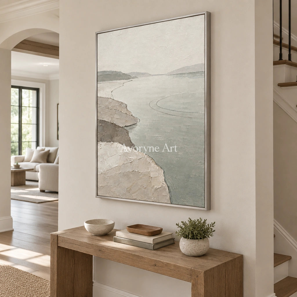 Tender Reverie waterside landscape wall art with a silver frame in an entryway