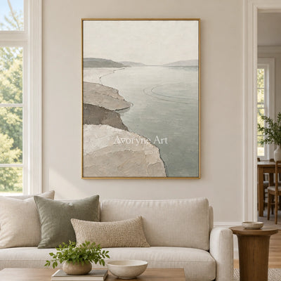 Tender Reverie waterside landscape wall art with a gold frame hanging in a living room
